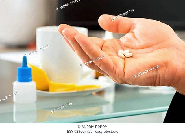 Businessman Holding Pills