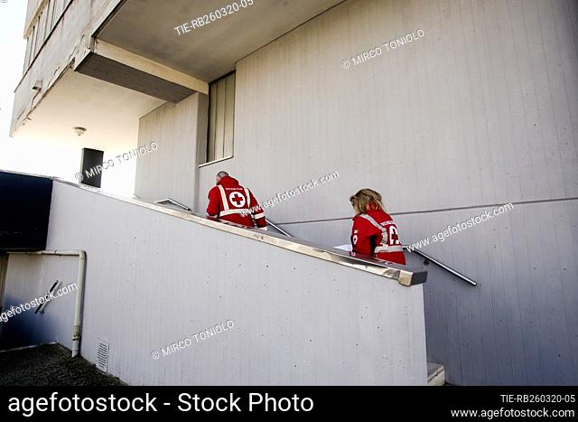Operators of Italian Red Cross during the service of grocery and medication home delivery to people unable to leave the house Mestre, ITALY-23-03-2020