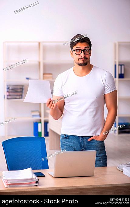 Young student employee at workplace