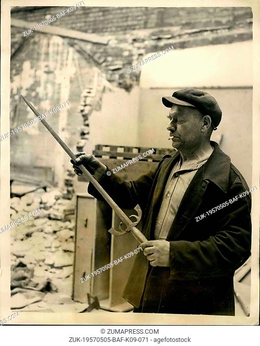May 05, 1957 - Sword discovered during demolition of Holborn Building . Scene of London Murder in 1949. Hidden among a pile of boxes and rubble on the roof of...