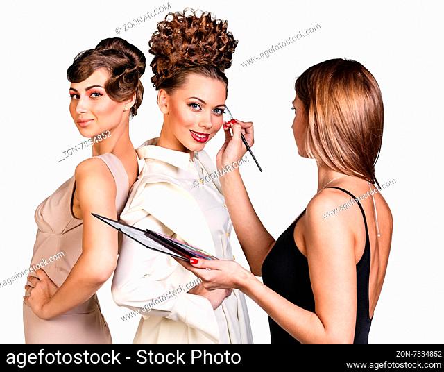 Make-up artist applying liner with a brush on model#39;s eyebrows