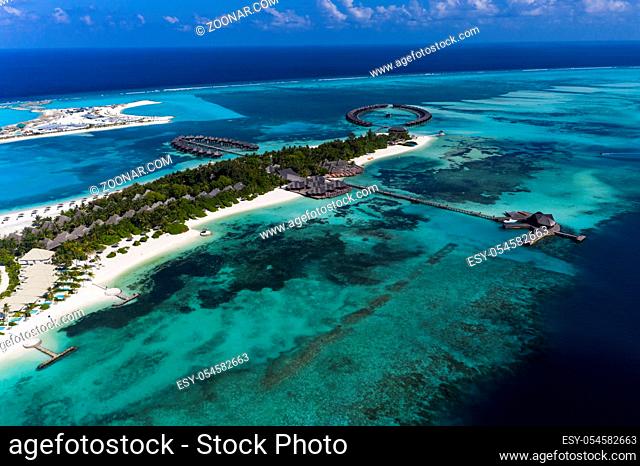 Aerial view, lagoon of Maldives island Olhuveli with water bungalows South Male Atoll, Maldives