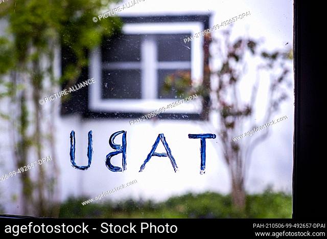 06 May 2021, Mecklenburg-Western Pomerania, Koserow: The word ""Tabu"" is written on a window pane at the former studio of the artist Otto Niemeyer-Holstein in...