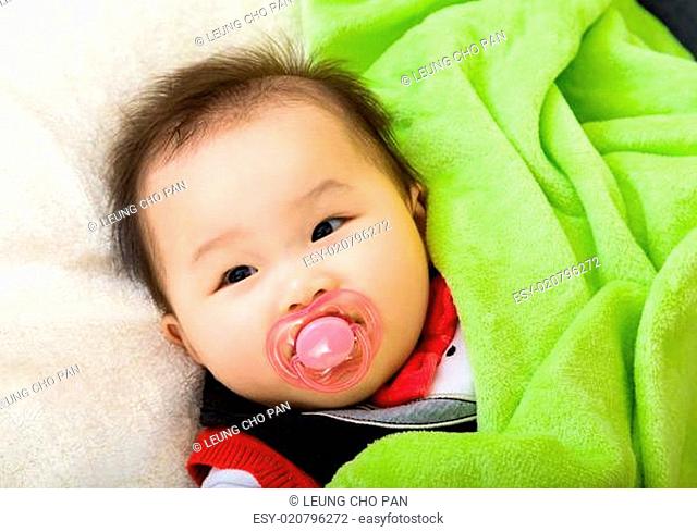 Asian baby with pacifier