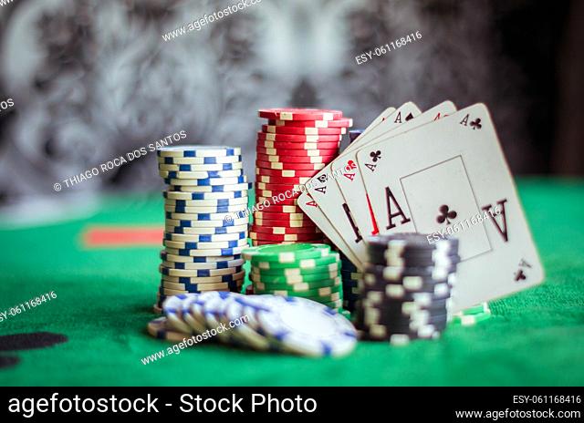 Stack of poker chips and four aces