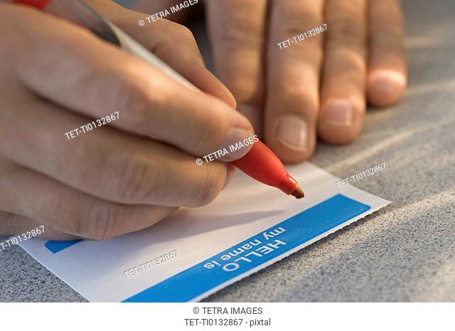 Man filling out name tag