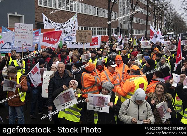 07 March 2023, Berlin: Participants in the warning strike of the public service union Verdi protest during a rally in front of the headquarters of Berlin's...