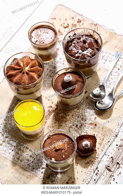 Glasses with different sorts of desserts