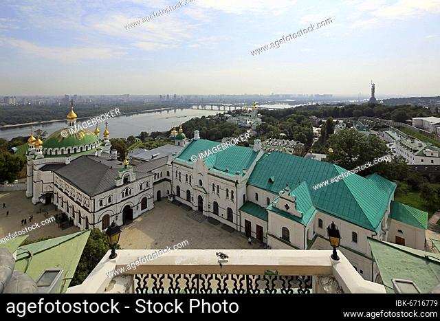 View of refectory, refectory church and Lower Lavra, in the back river Dnepr, Kiev Cave Monastery and monumental monument Mother Motherland, Kiev, Ukraine
