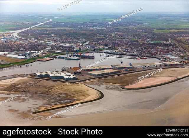 Aerial view harbor Delfzijl with wind turbines and factories in The Netherlands
