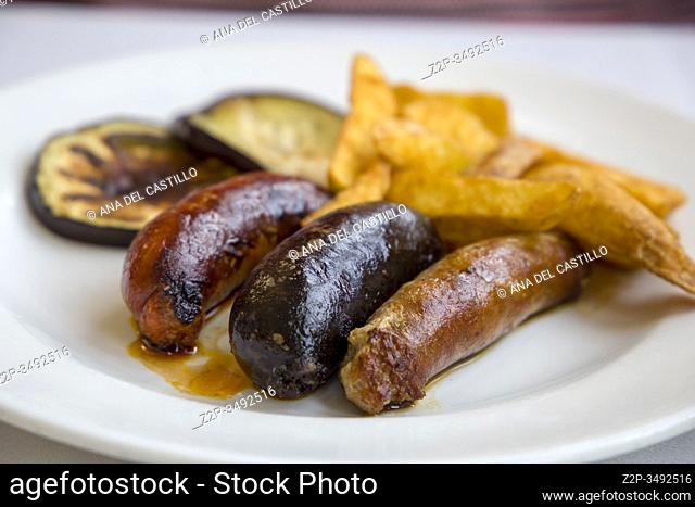 Plate with pork sausages and fries Spanish embutido