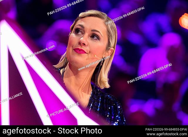 26 March 2022, North Rhine-Westphalia, Cologne: Ruth Moschner from the guessing team sits at the guessing desk in the Prosieben show ""The Masked Singer""