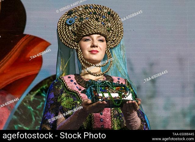 RUSSIA, MOSCOW - NOVEMBER 22, 2023: A model showcases a costume during a show of ethnic costumes inspired by the Ural tales and folk crafts