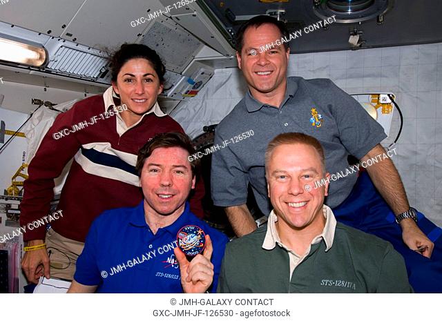 NASA astronauts Michael Barratt (left front), Expedition 20 flight engineer; Tim Kopra (right front), STS-128 mission specialist; Nicole Stott