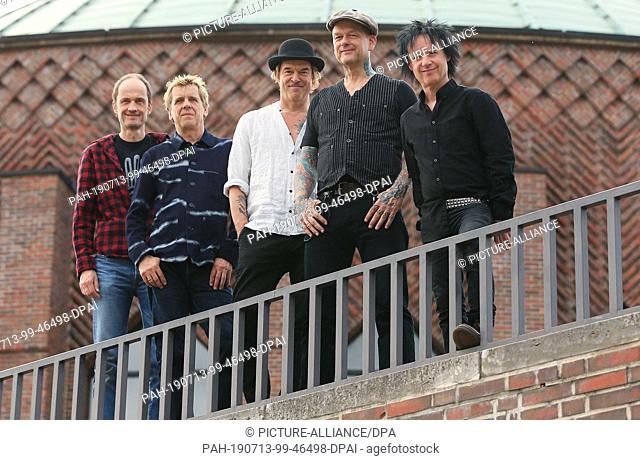 11 July 2019, North Rhine-Westphalia, Duesseldorf: The Düsseldorf punk band Die Toten Hosen with guitarist Michael Breitkopf alias Breiti (l-r)