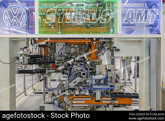 25 April 2022, Saxony, Meerane: The bolts of a pre-assembled rear axle with electric motor for a Volkswagen electric vehicle are screwed together fully...