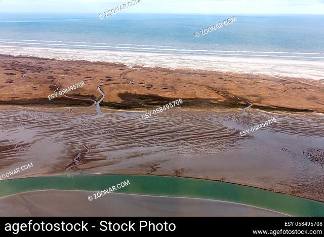 Aerial view Dutch island Schiermoniikoog, coastline with wetlands, mudflats and natural channels