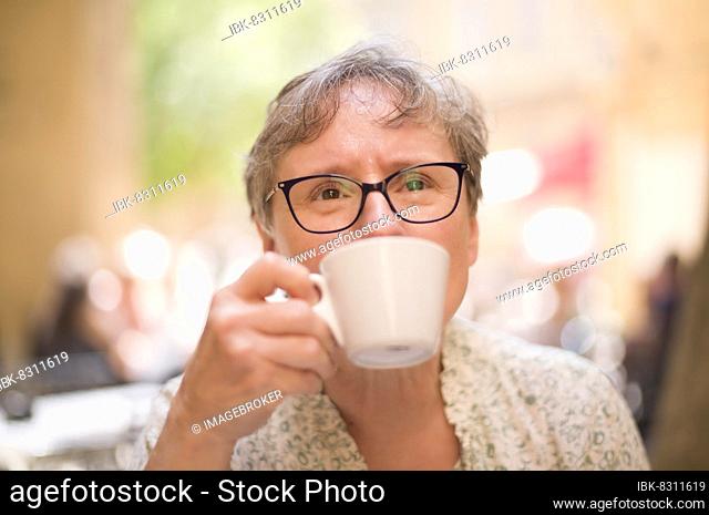 Elderly woman, Best Ager, portrait, glasses, drinking coffee, Aix-en-Provence, Bouches-du-Rhône, Provence-Alpes-Côte d'Azur, France, Europe