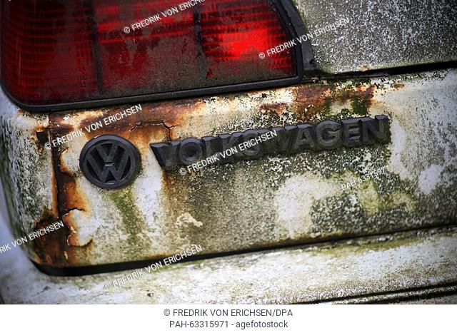 FILE - A file picture dated 23 September 2015 shows the VW badge on the back of an old Volkswagen Golf at a scrapyard in Wiesbaden, Germany