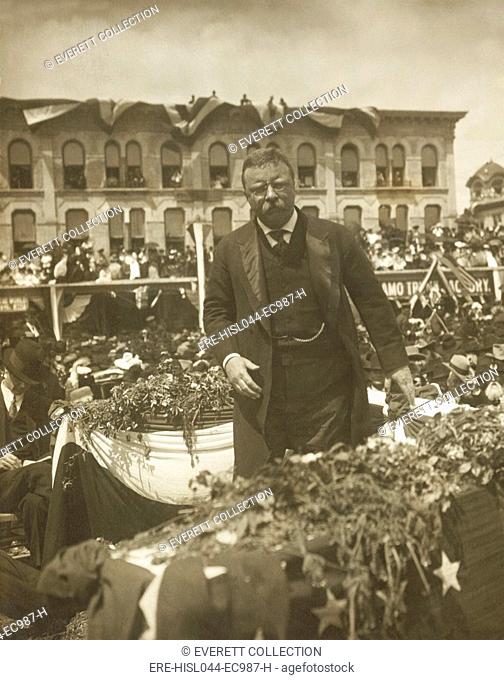 Theodore Roosevelt speaking to a large crowd at the Alamo, San Antonio, Texas, on April 7, 1905. The President recalled he had raised and trained his Spanish...