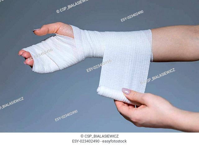 Woman with bandage on the wrist