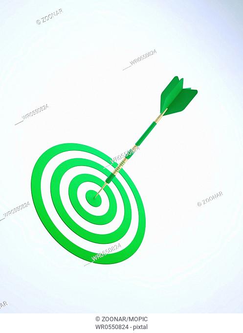 A green dart on an abstract dartboard