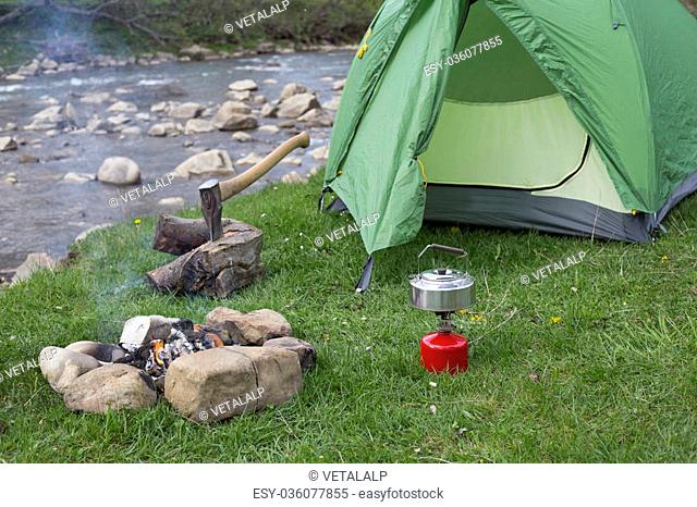 Camping in the woods on the banks of the river