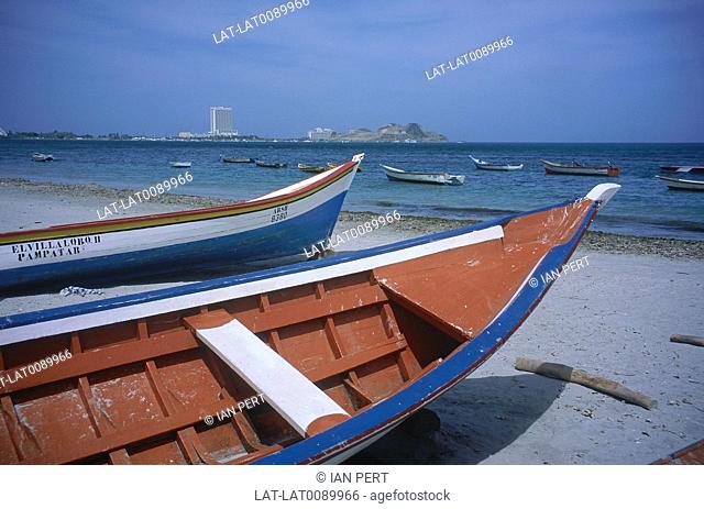 Belle Vista Beach. Two wooden boats on sand