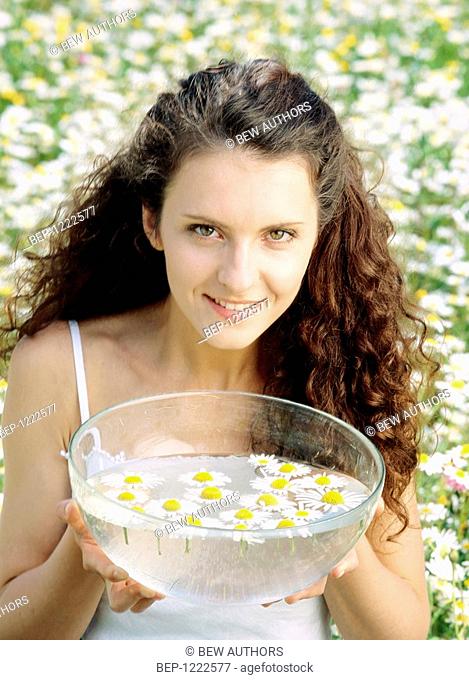 Woman with camomile