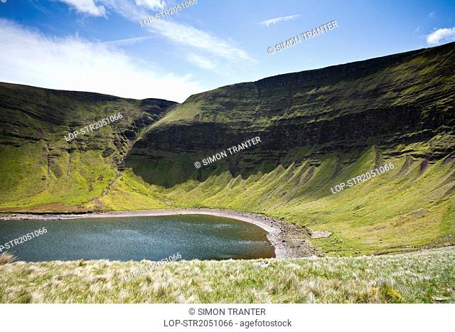 Wales, Carmarthenshire, Black Mountain. Llyn y Fan Fach and Bannau Sir Gaer cliffs in the Brecon Beacons National Park