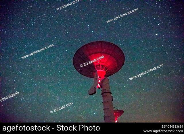 Radio Telescope view at night with milky way in the sky
