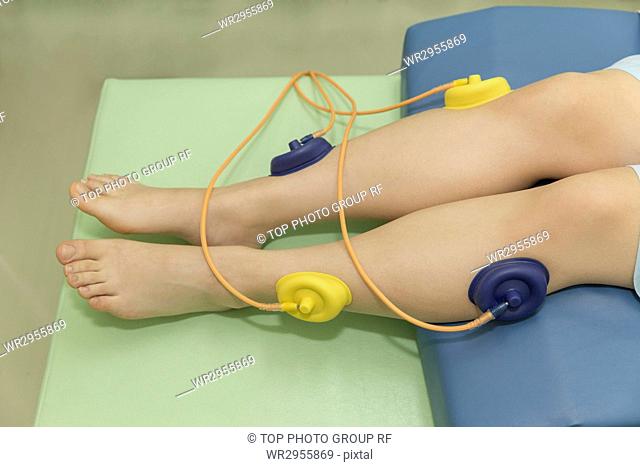 Legs Electrotherapy Performed by Doctor