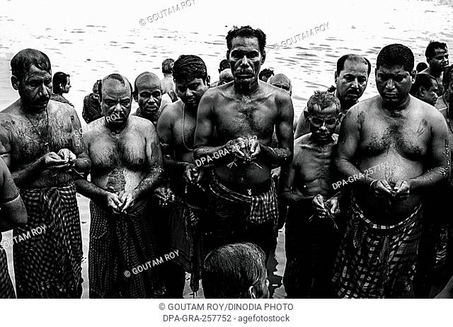 people performing rituals at river ganga, kolkata west bengal, India, Asia