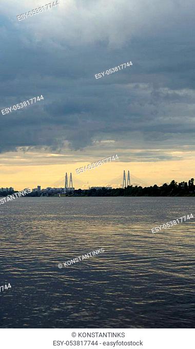 Neva river and cable-stayed bridge at sunset in St. Petersburg, Russia