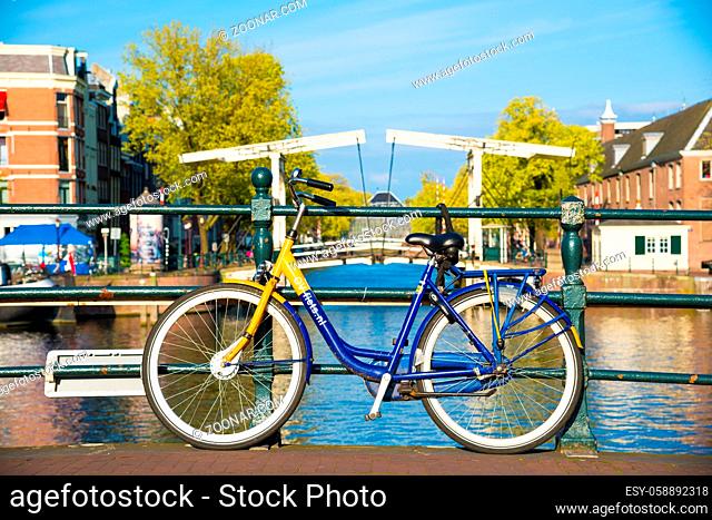 Amsterdam, Netherlands - April 19, 2017: Bikes on the bridge in Amsterdam, Netherlands