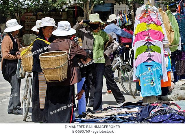 Street scene with Tibetans with clothes stands