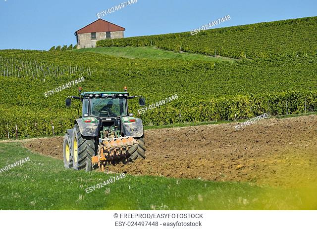 Tractor plowing the fields Champagne France Europe