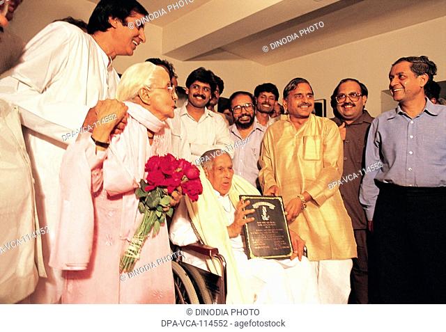 South Asian Indian poet Harivanshrai Bachchan being honored by UP Chief Minister Mulayam Singh Yadav at a function in his house "Prateeksha" at Juhu ; Bombay...
