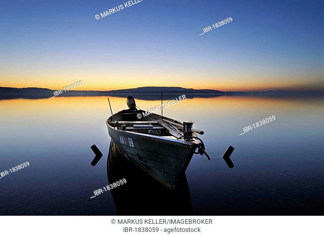 Evening mood with a fishing boat on the shore of the island of Reichenau, Konstanz district, Baden-Wuerttemberg, Germany, Europe