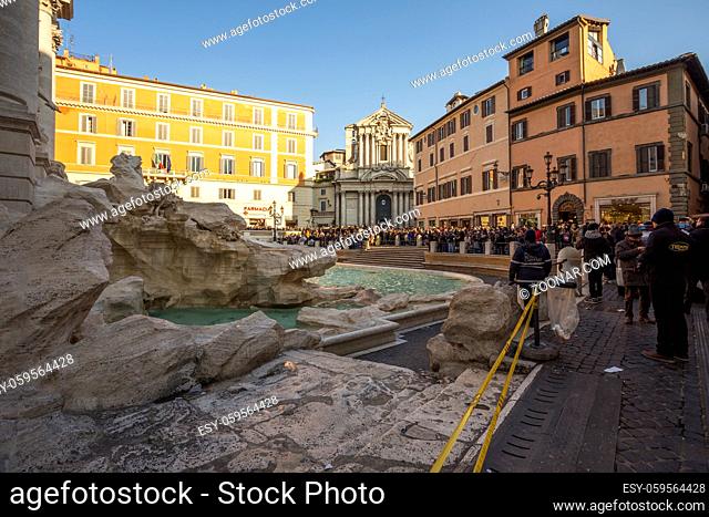 Fountain di Trevi surronded by hundreds of tourists