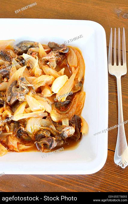 Stew of snail and fork
