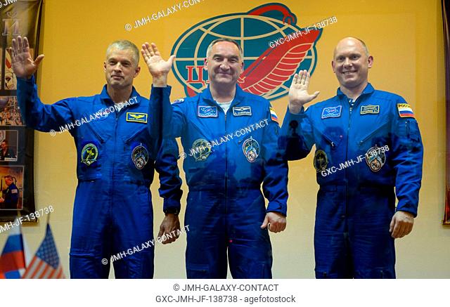 From the left, Expedition 39 Flight Engineer Steve Swanson of NASA, Soyuz Commander Alexander Skvortsov of the Russian Federal Space Agency