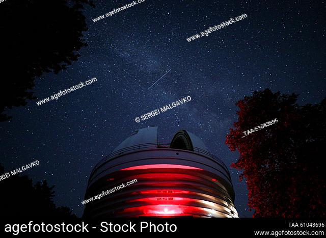 RUSSIA, REPUBLIC OF CRIMEA - AUGUST 12, 2023: A view of falling stars of the Perseid meteor shower in the sky over the Crimean Astrophysical Observatory in the...