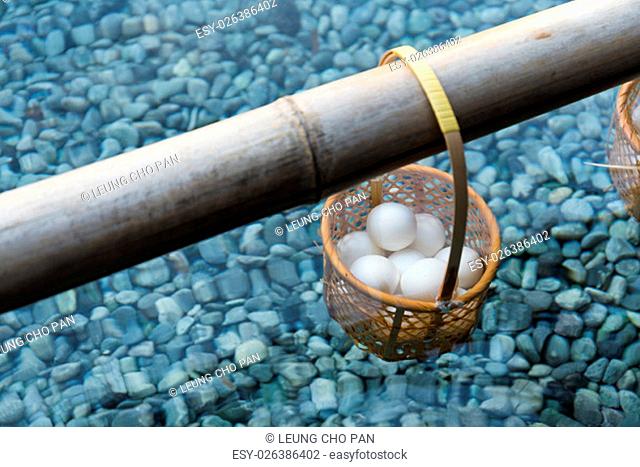 Japanese hot spring steam boil eggs dip basket in pond
