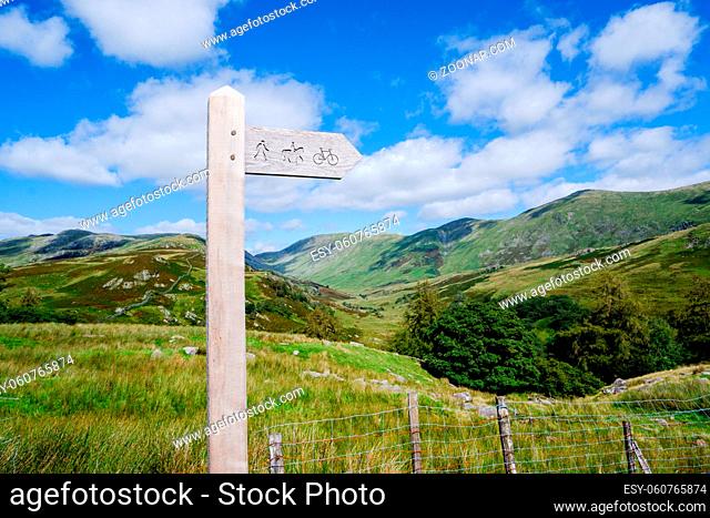 wooden public bridleway sign post on Kirkstone Pass in The Lake District