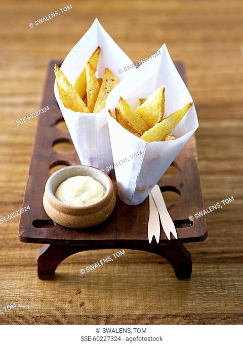 Small cones of homemade french fries and truffle-flavored mayonnaise