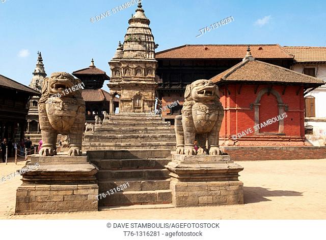 Vatsala Temple and stone lions in Durbar Square in ancient Bhaktapur, near Kathmandu, Nepal