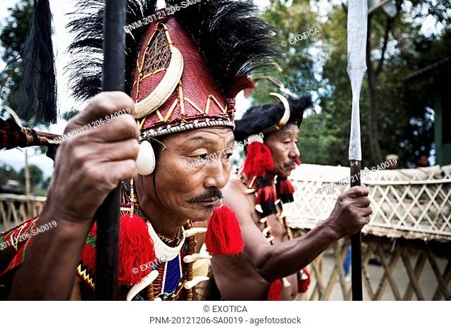Two Naga tribal warriors in traditional outfit, Hornbill Festival, Kohima, Nagaland, India