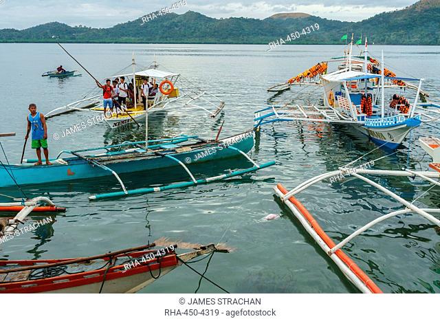 Early morning bangka taxis (outrigger canoes), Coron Harbour, Busuanga island, Philippines, Southeast Asia, Asia