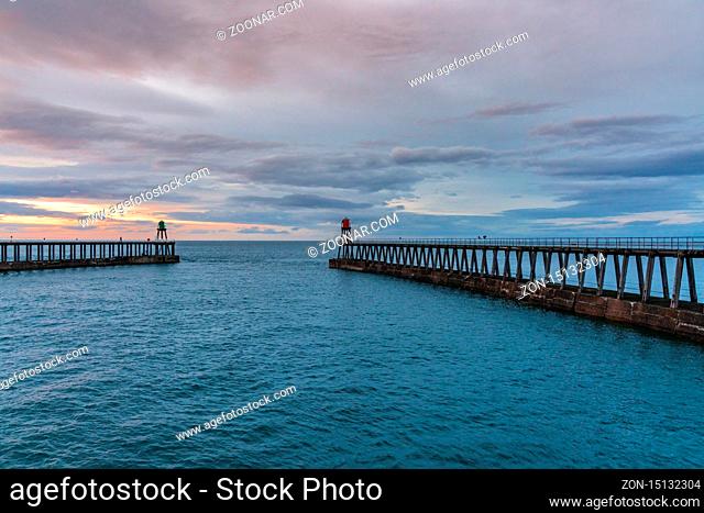 Whitby, North Yorkshire, England, UK - September 13, 2018: View towards East Pier and West Pier